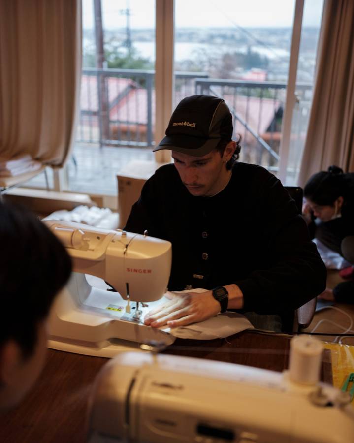 At the sewing machine by the window