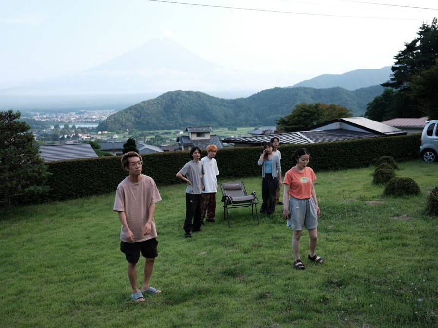 On the lawn with Mt. Fuji behind