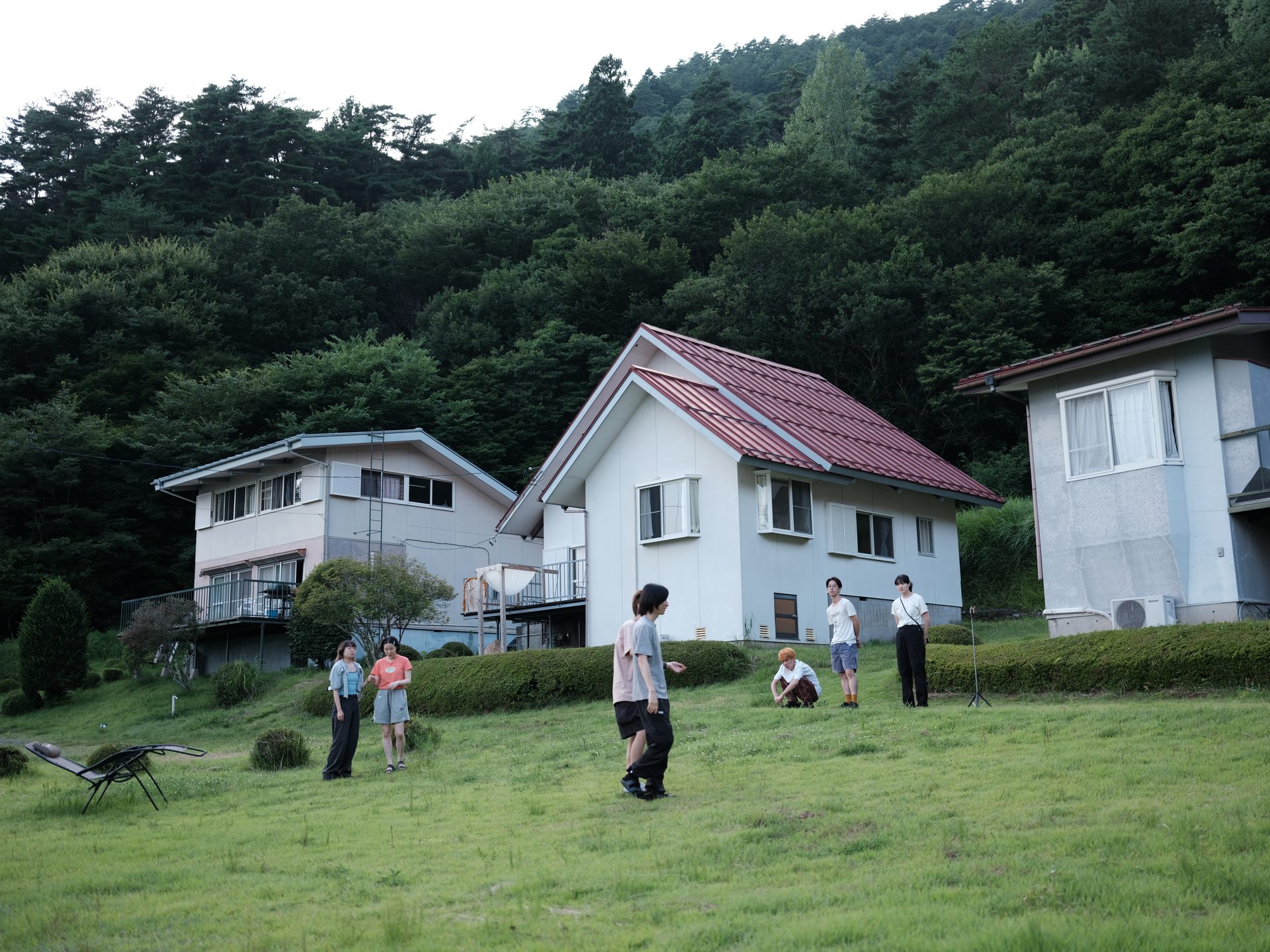 The six houses of 6okken on a green slope